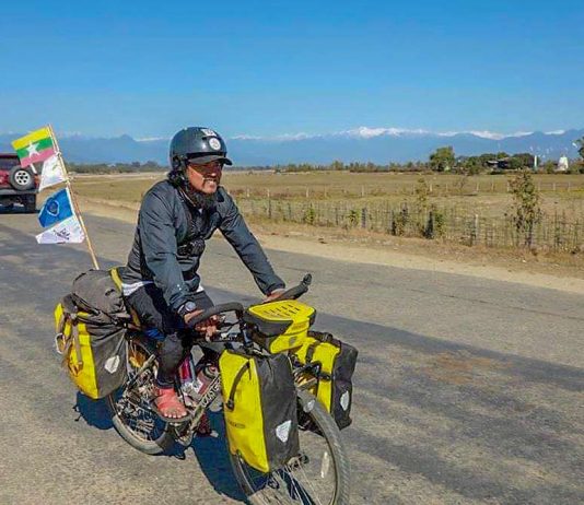 မြန်မာပြည် မြောက်ဖျားဘက်မှ တောင်ဘက်ဖျားထိ စက်ဘီးစီးခရီးနှင်နေသူ ဝင်းကိုကို